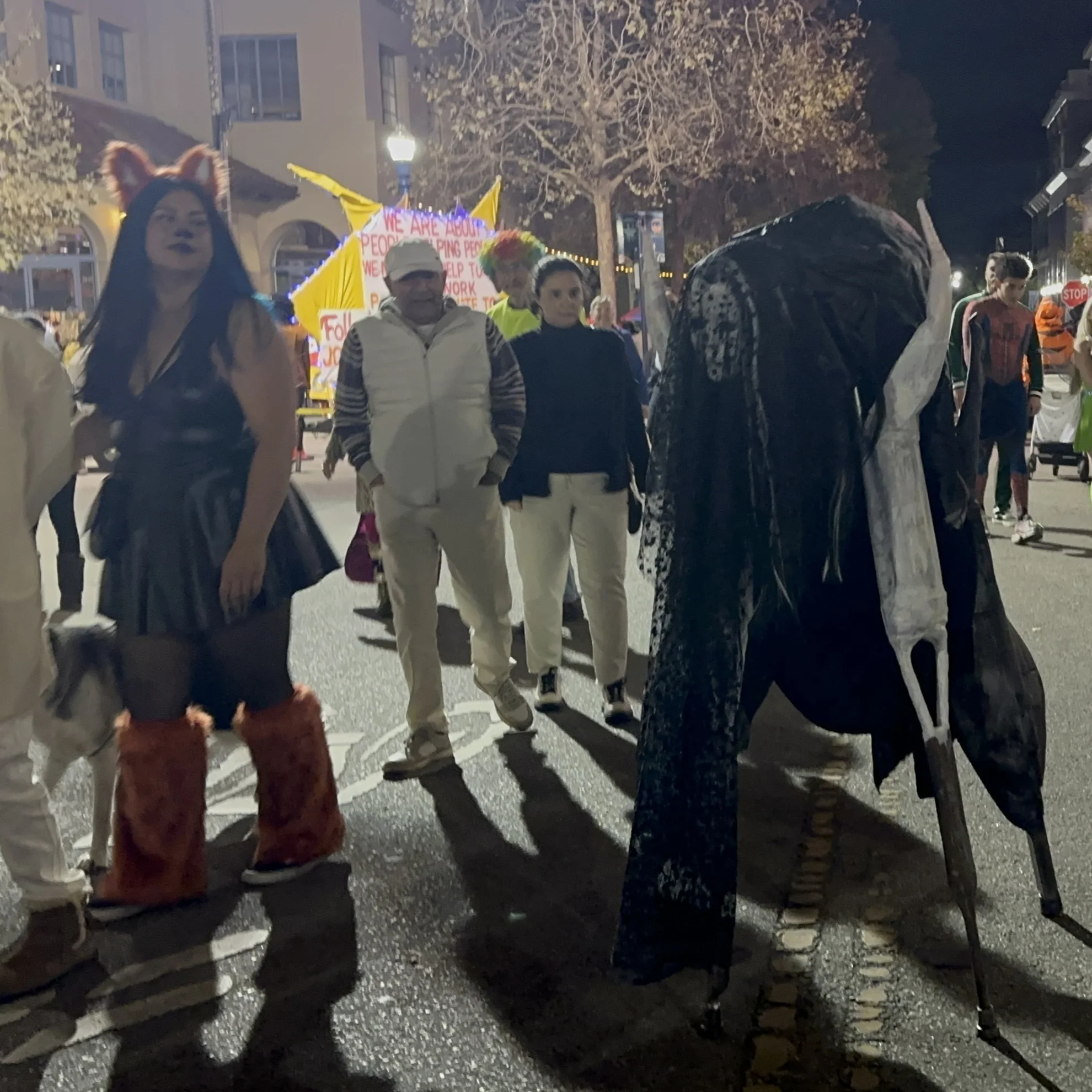 A 4-legged creature on stilts for a Halloween costume