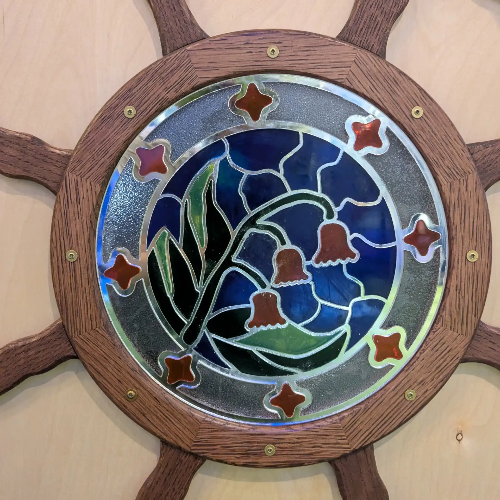 Acrylic lasercut flower in a stained glass style, fully installed