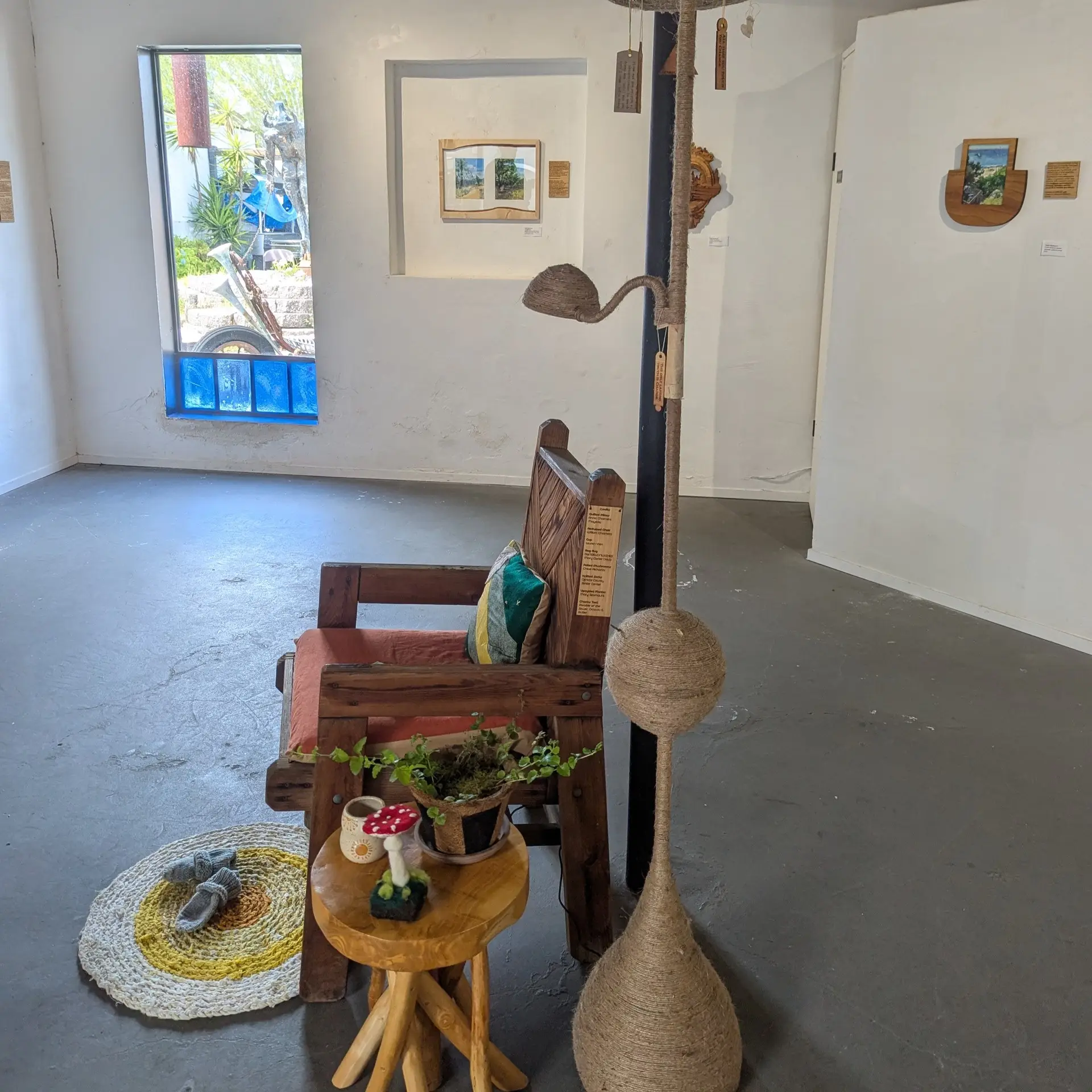 Reading Nook installation by Taylor Seamount, featuring a needlefelted mushroom on a table
